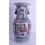A MID 19TH CENTURY CHINESE CANTON FAMILLE ROSE VASE Qing, painted with figures within landscapes. 36