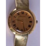 A RARE 18CT GOLD BULOVA ACCUTRON GENTLEMANS WRISTWATCH with gold dial, gold strap and black