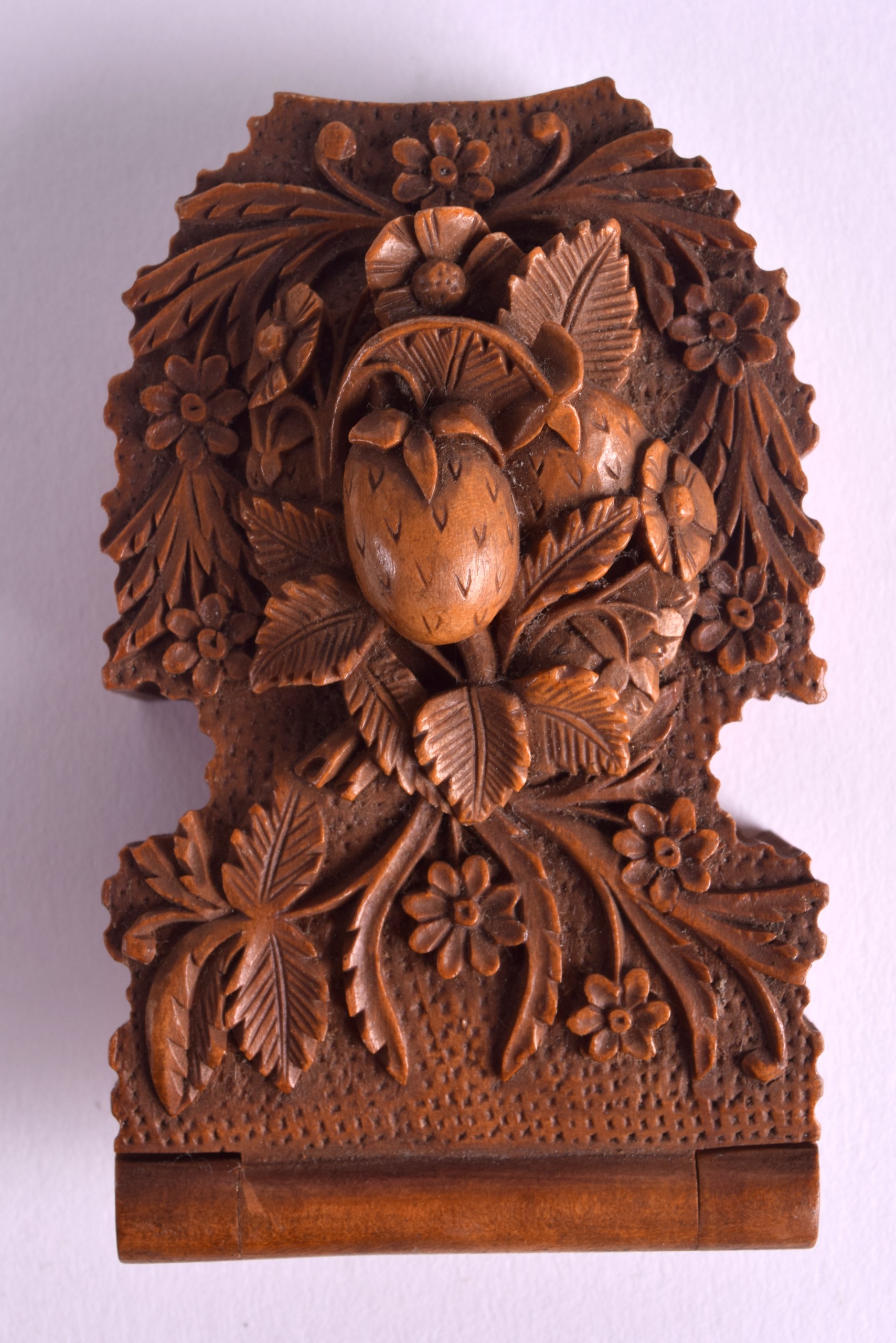 A 19TH CENTURY CONTINENTAL FRUITWOOD SNUFF BOX AND COVER of unusual form decorated with strawberries