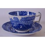 A 19TH CENTURY SPODE COPELANDS BLUE AND WHITE MOUSTACHE CUP AND SAUCER, decorated with landscape