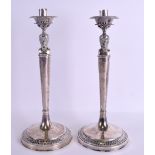 A PAIR OF MID 19TH CENTURY ITALIAN VATICAN SILVER CANDLESTICKS formed with opposing classical mask
