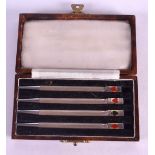 A SET OF FOUR ART DECO SILVER AND ENAMEL BRIDGE PENS. (4)