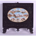 A LARGE 19TH CENTURY INDIAN PAINTED IVORY MINAITURE within an ebonised frame, depicting nine views