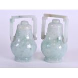 A GOOD PAIR OF EARLY 20TH CENTURY CHINESE CARVED ICEY JADEITE VASES AND COVERS Qing, engraved with