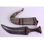 A 19TH CENTURY MIDDLE EASTERN YEMENI JAMBIYA DAGGER with Rhinoceros horn handle, silver inlaid