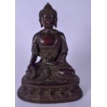 A LARGE 19TH CENTURY CHINESE BRONZE BUDDHA, in the form of Shakyamuni, modelled with a vessel in one