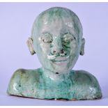 A STUDIO POTTERY BUST OF A YOUNG BOY, modelled with green drip glaze. 19.5 cm wide.