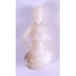 AN UNUSUAL EARLY 20TH CENTURY CHINESE CARVED JADE FIGURE OF A FEMALE Late Qing. 5 cm x 2 cm.
