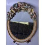 AN EARLY 20TH CENTURY BARBOLA MIRROR, decorated with extensive flowers. 45 cm x 32 cm.