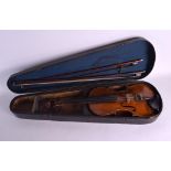 AN ANTIQUE TWO PIECE BACK VIOLIN together with two bows. Violin 59 cm long. (3)