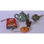 A 20TH CENTURY KOREAN CELADON MINIATURE TEA POT, together with a wooden cockerel and two others. (