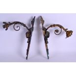 A PAIR OF LATE 19TH CENTURY FRENCH GILT METAL WALL SCONCES decorated with rams mask heads and