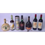 TWO BOTTLES OF CHATEAU MICHEL DE MONTAIGNE 1985, together with five other bottles of alcohol. (7)