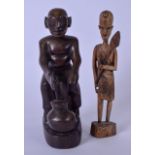 A 20TH CENTURY CARVED AFRICAN WOODEN FIGURE OF A TRADESMAN, together with a smaller figure of a