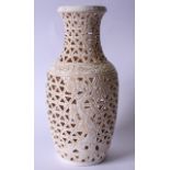 A LARGE CHINESE BLANC DE CHINE RETICULATED VASE, decorated with a flowering tree and symbols. 45
