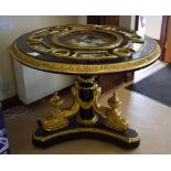 A LARGE ORMOLU MOUNTED CIRCULAR TABLE, inset with panels in the Sevres style depicting lovers in