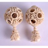 A PAIR OF 19TH CENTURY CHINESE CARVED IVORY PUZZLE BALLS Qing, with fruiting floral finials. 9 cm