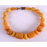 AN EARLY 20TH CENTURY CONTINENTAL BUTTERSCOTCH AMBER NECKLACE. 102 grams. 38 cm long.