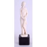 AN EARLY 20TH CENTURY EUROPEAN CARVED IVORY FIGURE OF A FEMALE by Antoine Boulard, modelled upon a