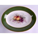 A ROYAL WORCESTER OVAL DISH C1910 painted with fruit by George Cole. 27 cm wide.