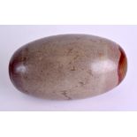 A LARGE UNUSUAL CHINESE CARVED BUDDHIST LINGAM STONE of polished form with large red tones. 21 cm