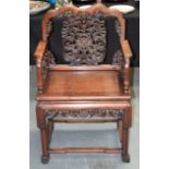 A 19TH CENTURY CHINESE CARVED HARDWOOD CHAIR with extensively carved back splat, formed with bats