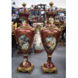 A MONUMENTAL PAIR OF VIENNA STYLE PORCELAIN VASES, decorated with panels of lovers and bronze
