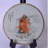A CHINESE PORCELAIN PLAQUE, 20th century, decorated with a figure in a landscape. 26.5 cm.