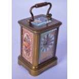 AN EARLY 20TH CENTURY MINIATURE CARRIAGE CLOCK WITH PINK PORCELAIN PANELS, decorated with