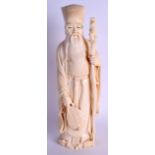 A GOOD LARGE 19TH CENTURY JAPANESE MEIJI PERIOD CARVED IVORY OKIMONO modelled as a standing male