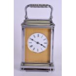 AN EARLY 20TH CENTURY FRENCH SILVER PLATED REPEATING CARRIAGE CLOCK with engine turned brass dial.