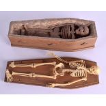 A CHARMING EARLY 20TH CENTURY APPRENTICE MADE COFFIN AND COVER with skeleton, together with