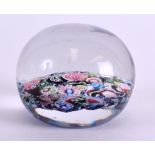 A 19TH CENTURY FRENCH CLICHY SCRAMBLE PAPERWEIGHT decorated with foliage. 6 cm wide.