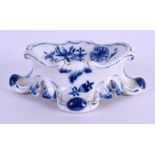 A 19TH CENTURY MEISSEN BLUE AND WHITE PORCELAIN SALT painted with the onion pattern. 10 cm x 3 cm.