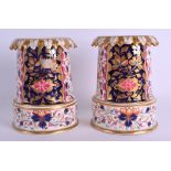 AN UNUSUAL PAIR OF EARLY 19TH CENTURY DERBY VASES painted in the imari style. 15 cm high.