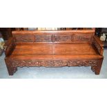 A GOOD 19TH CENTURY CHINESE CARVED HARDWOOD BENCH Qing, decorated with panels of beasts amongst