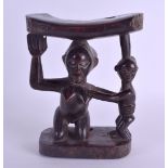AN EARLY 20TH CENTURY AFRICAN TRIBAL CARVED WOOD STOOL modelled as a mother and child. 19 cm x 14