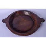 A LARGE 18TH CENTURY CARVED WOODEN DISH OR TRAY, formed with twin handles. 49 cm wide.`