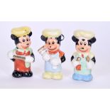A SET OF THREE VINTAGE MICKEY MOUSE PORCELAIN FIGURES, modelled with baking equipment. 7.5 cm high.