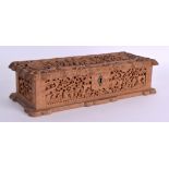 A MID 19TH CENTURY CHINESE CARVED SANDALWOOD CASKET AND COVER decorated with figures within
