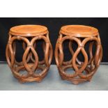 A PAIR OF EARLY 20TH CENTURY CHINESE CARVED HARDWOOD BARREL SEATS Qing/Republic, of openwork form