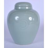 A CHINESE CELADON GROUND PORCELAIN VASE OR JAR AND COVER, of plain form and bearing Qianlong marks