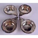 A SET OF FOUR LATE 19TH CENTURY CHINESE EXPORT SILVER WINE TASTERS decorated in relief with