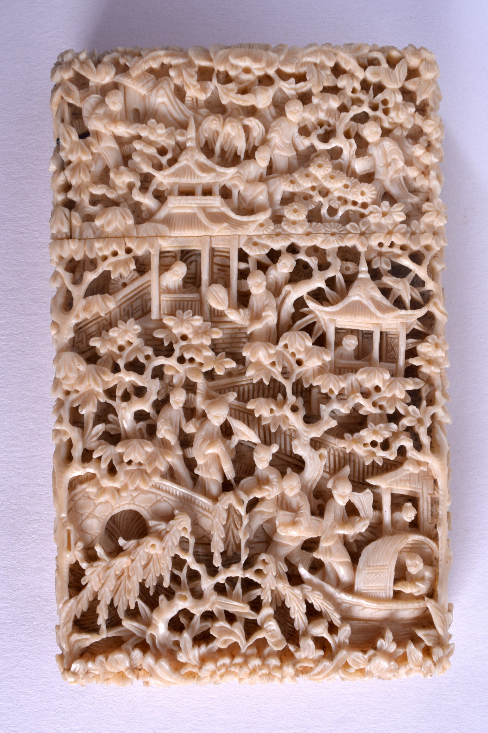 A MID 19TH CENTURY CHINESE CANTON CARVED IVORY CARD CASE decorated with figures in landscapes