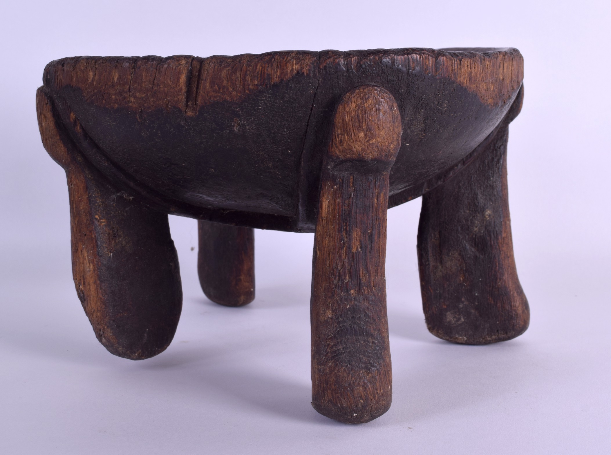 AN EARLY 20TH CENTURY AFRICAN TRIBAL CARVED WOOD STOOL possibly Tanzanian, with dish shaped top. - Image 2 of 3