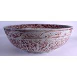A VERY LARGE EARLY 20TH CENTURY CHINESE IRON RED PAINTED SHALLOW BOWL Ming style, painted with