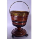 AN EARLY 20TH CENTURY DUTCH WOODEN BUCKET, ribbed body on pedestal base with ball feet. 55 cm high