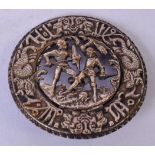 A SILVER PLAQUE OR BADGE DEPICTING TWO KNIGHTS FIGHTING, the border decorated with mythical