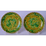 A PAIR OF 20TH CENTURY CHINESE SANCAI PORCELAIN DISH BEARING QIANLONG MARKS, painted with a dragon