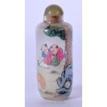 A CHINESE REVERSE PAINTED SNUFF BOTTLE, decorated with figures in a landscape.7.5 cm high.